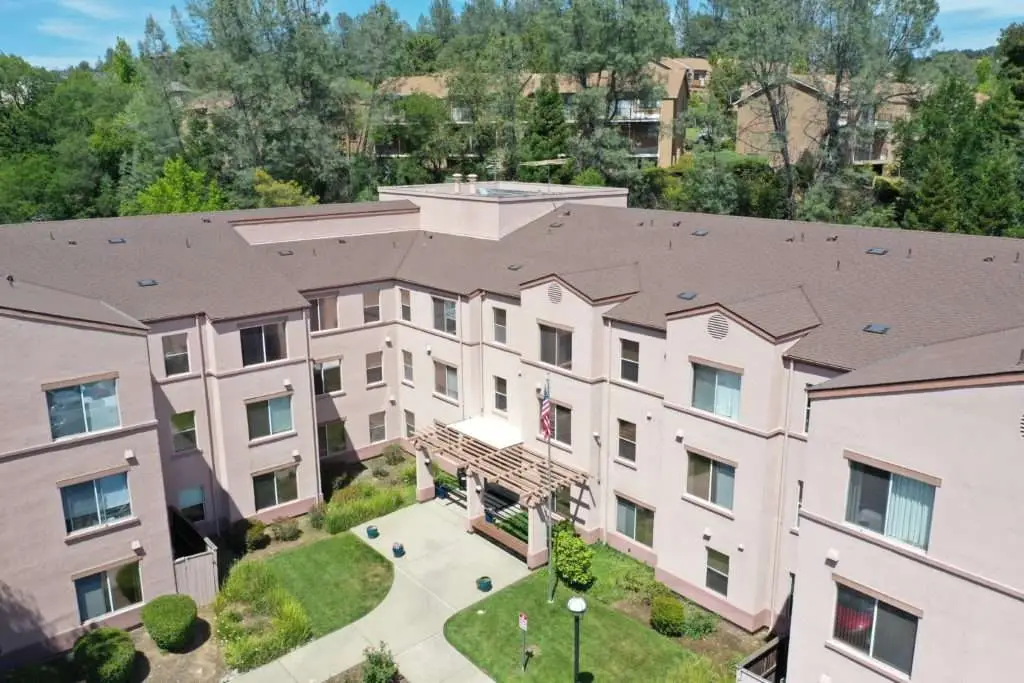 Aerial view of an apartment complex after a commercial roof replacement