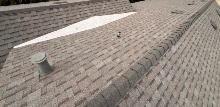 New 60 mil TPO installed over the cricket on an Elk Grove shingle roof replacement