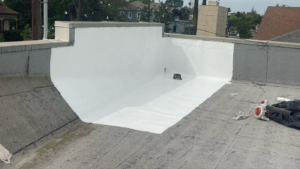 Commercial flat roof in Elk Grove after seams were sealed and a silicone coating was applied