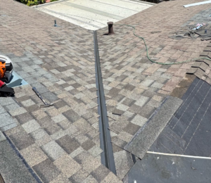 Finished shingle roof valley repair in Elk Grove with new valley metal and color-matched shingles