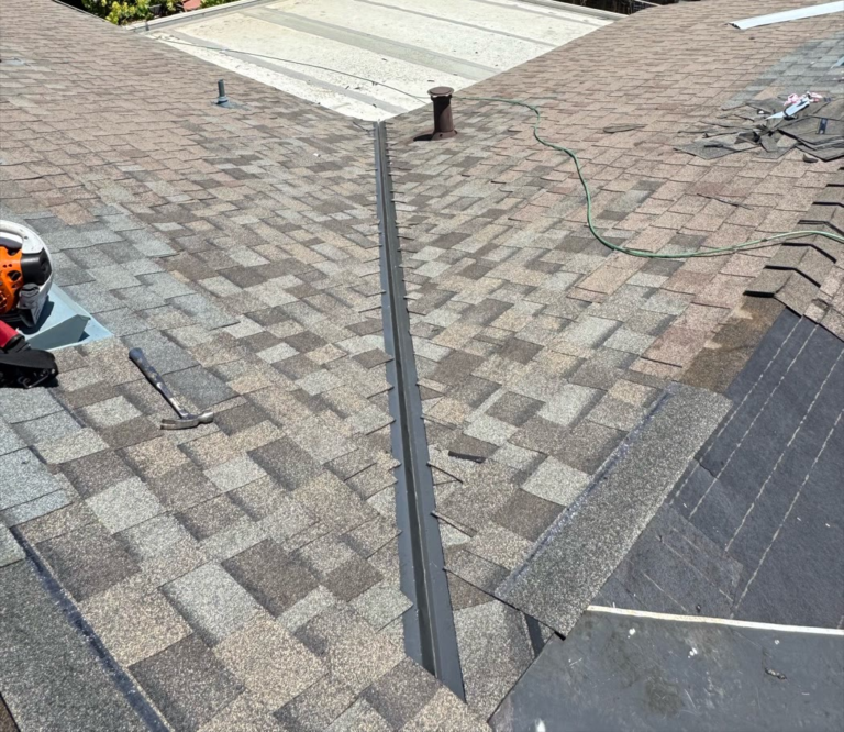 Finished shingle roof valley repair in Elk Grove with new valley metal and color-matched shingles