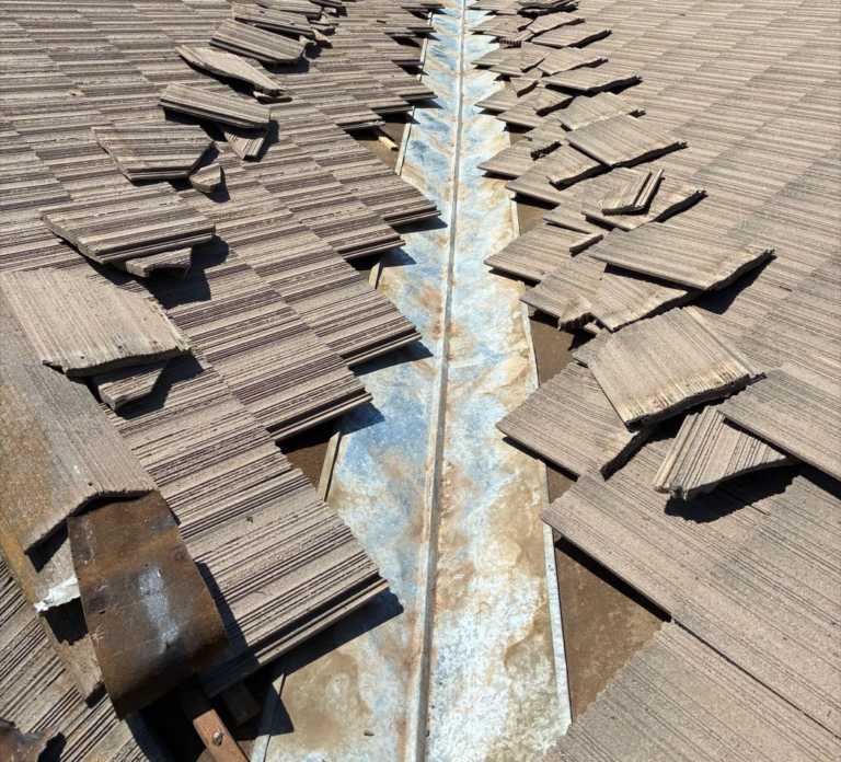 Tile roof valley flashing in Elk Grove after being cleaned out so water drains off the roof