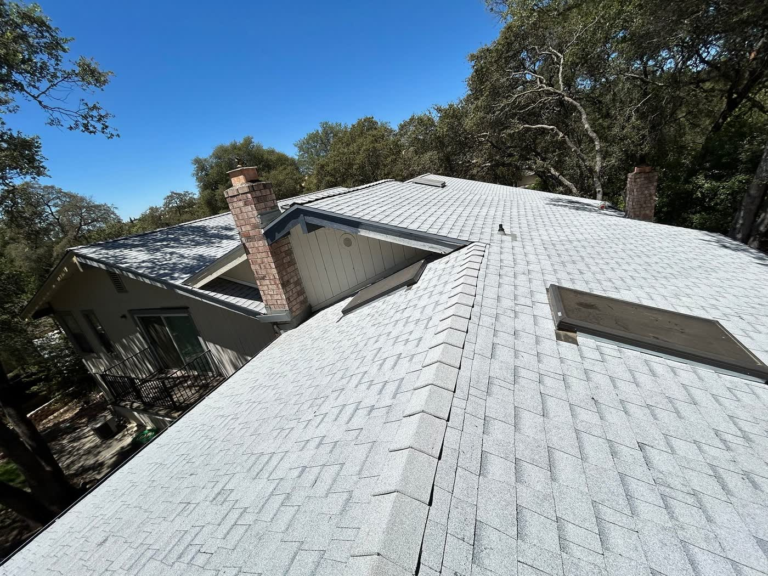 Finished Owens Corning shingle roof replacement on a Rocklin home surrounded by oak trees
