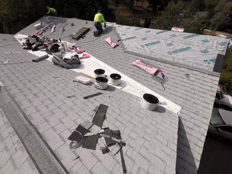 Roof Recovery crew installing underlayment and new shingles during a Rocklin roof replacement