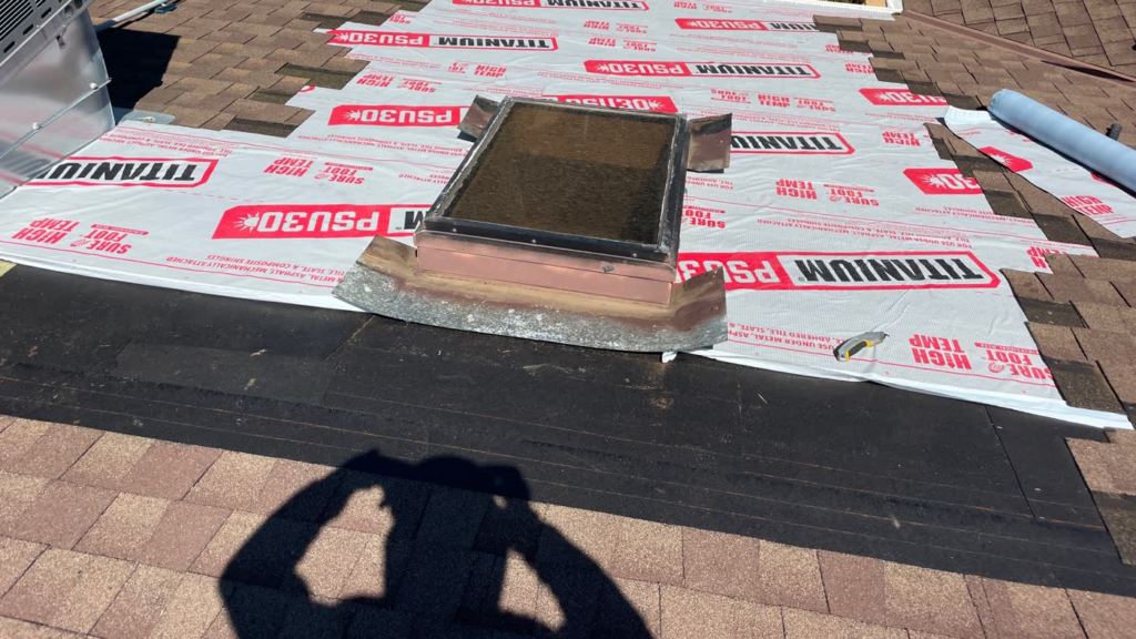 Old shingles removed and new ice and water shield installed around a skylight on a Rocklin shingle roof