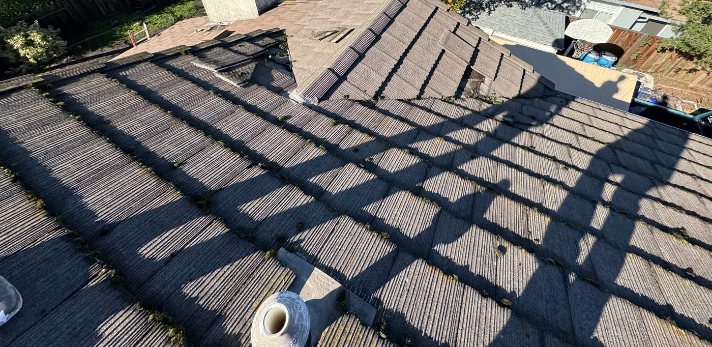Rocklin concrete tile roof with clogged valleys that caused leaks across the roof before replacement