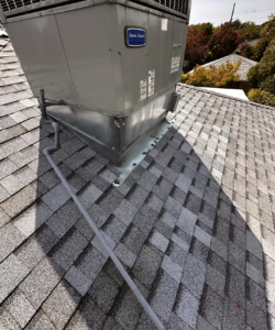 Rebuilt and flashed area around a rooftop HVAC unit on a Sacramento shingle roof