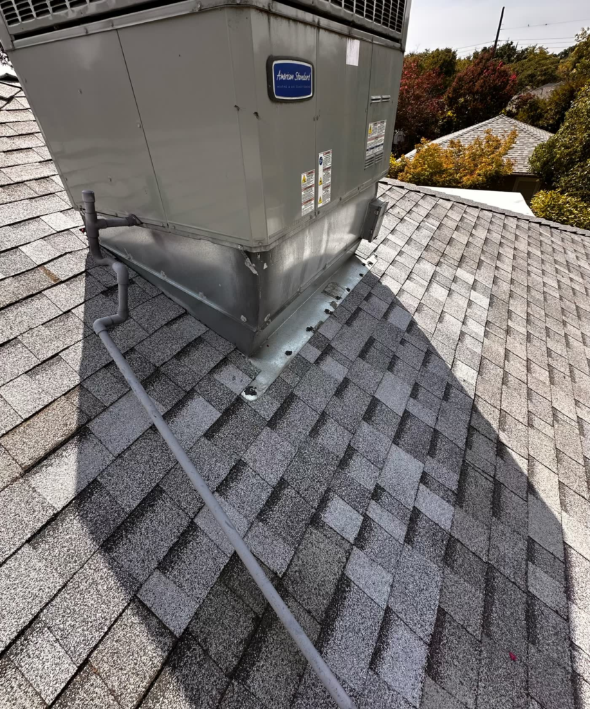 Rebuilt and flashed area around a rooftop HVAC unit on a Sacramento shingle roof