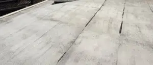 Worn flat roof in Sacramento with split, cracked seams before replacement